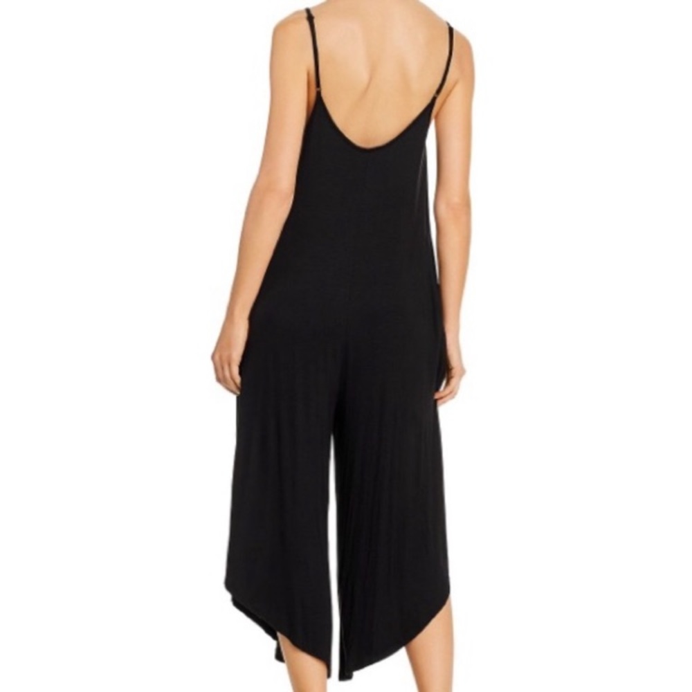 Elegant Black Jumpsuit with Modern Silhouette Runs big